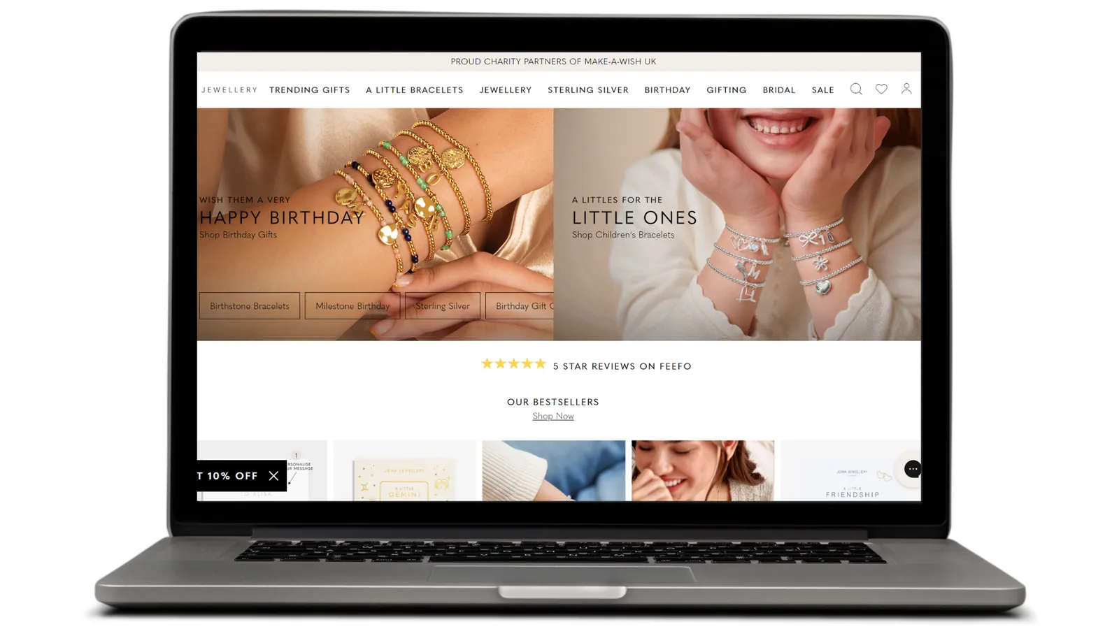Laptop showing Joma Jewellery home page on Adobe Commerce Cloud